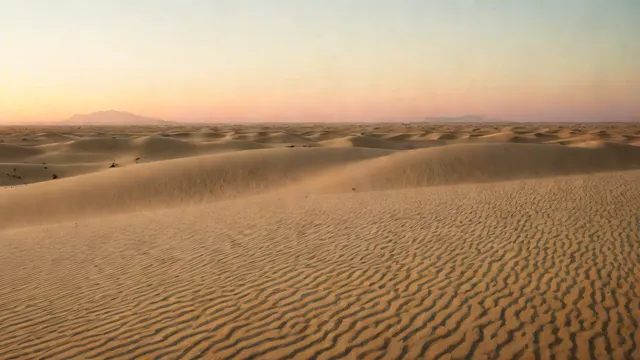 Desert dunes at twilight with abstract geometric patterns in the sand texture